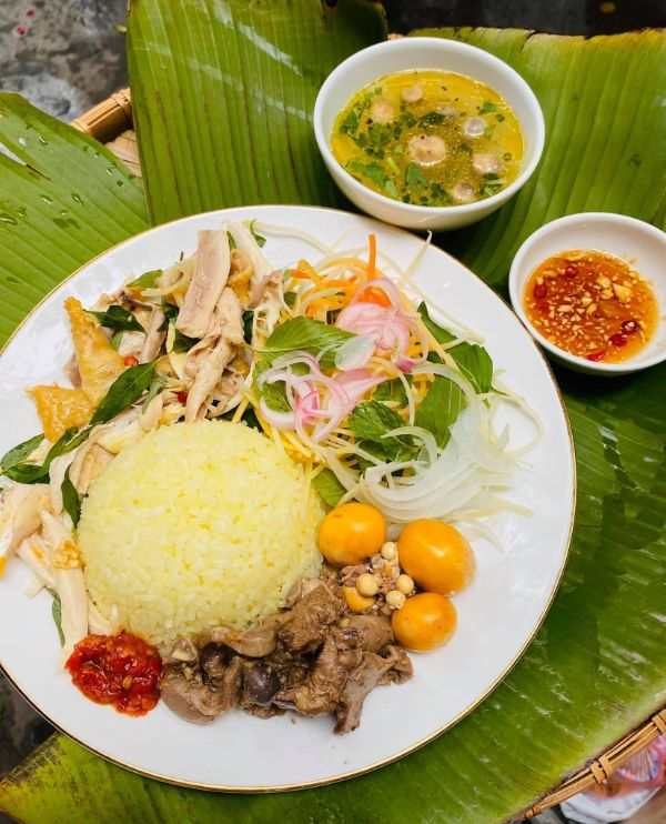 Hoi An chicken rice with turmeric rice and herbs
