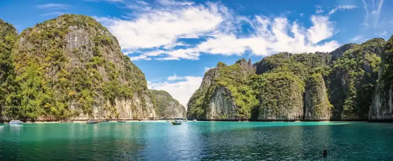 Phi Phi’s jade lagoon—iconic scenery from a Phi Phi & Khai Islands day tour from Phuket.