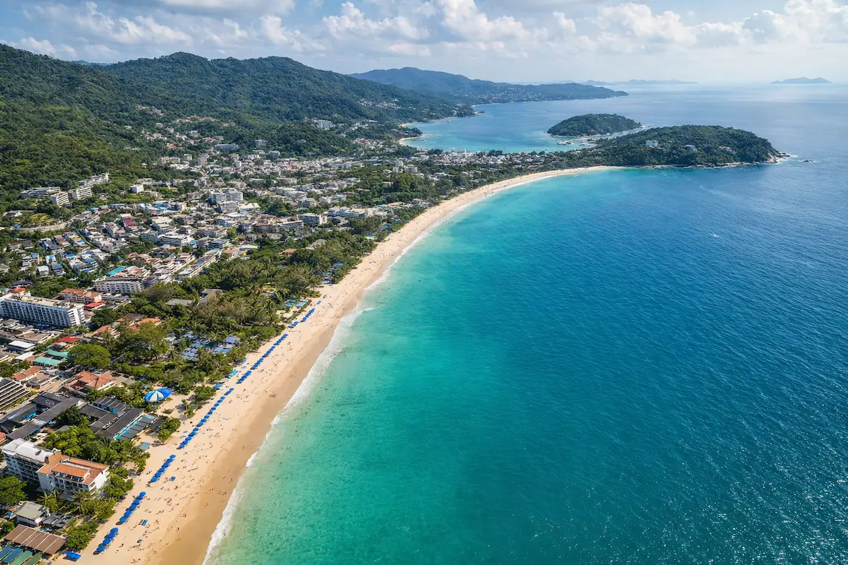 Where to stay in Phuket showing coastline with beach and town areas