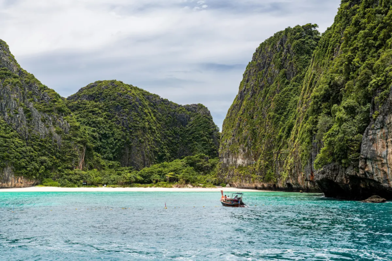 Phuket day trips to Phi Phi islands with longtail boat and limestone cliffs