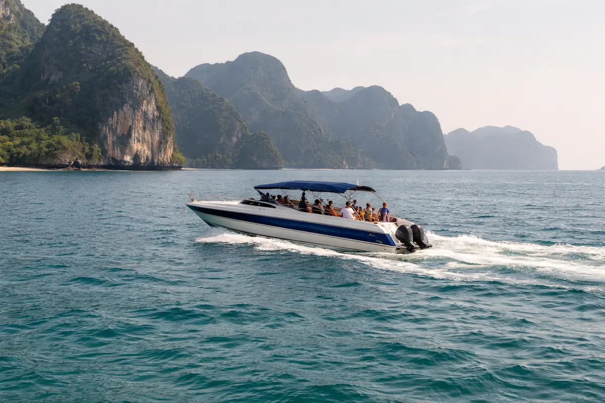 Phi Phi Islands speedboat tour Phuket Thailand with limestone cliffs and ocean