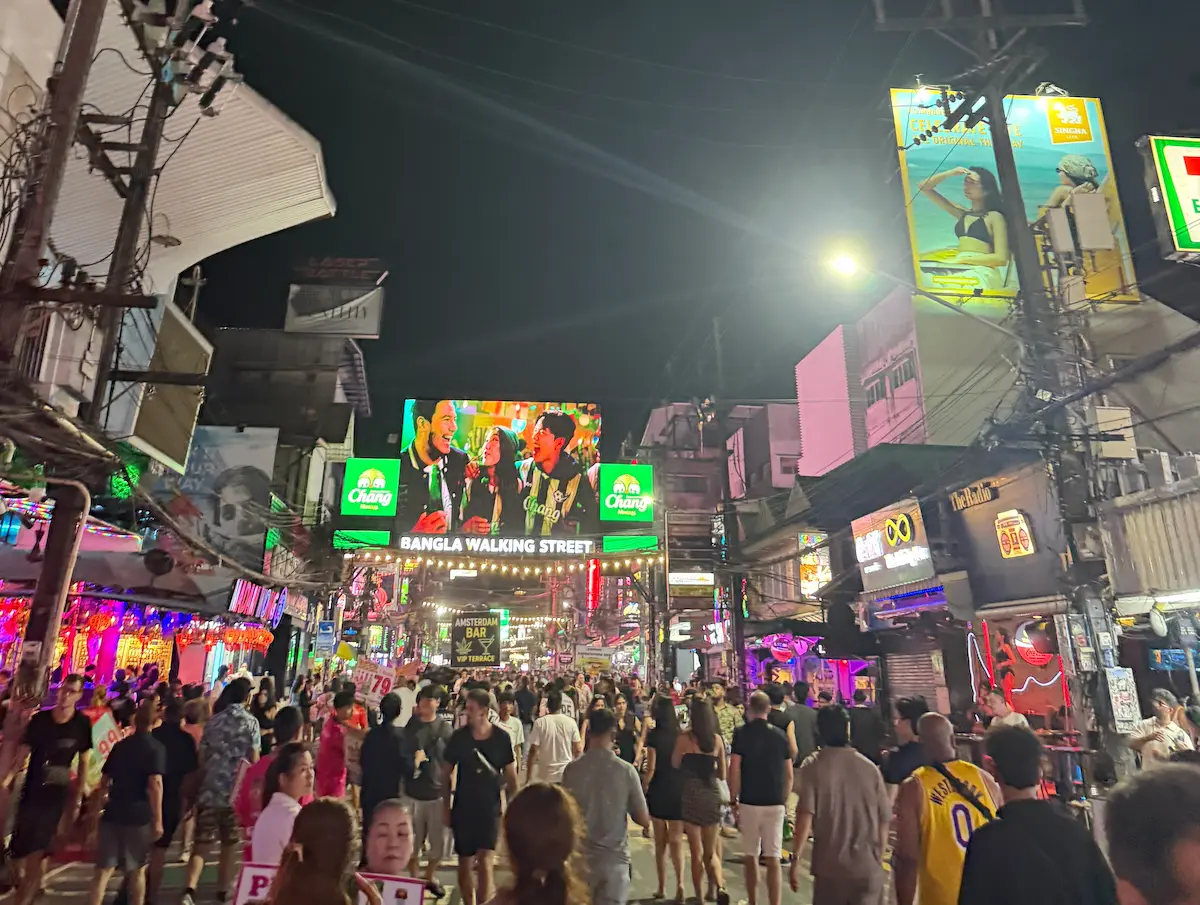 What to do in Patong Beach Phuket with people in waves and shoreline activity