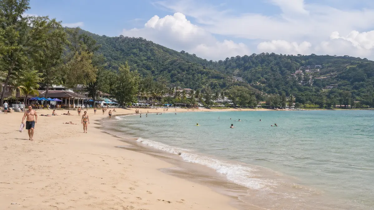 Phuket beach showing moderate activity and a balanced environment compared to Kamala Beach Phuket