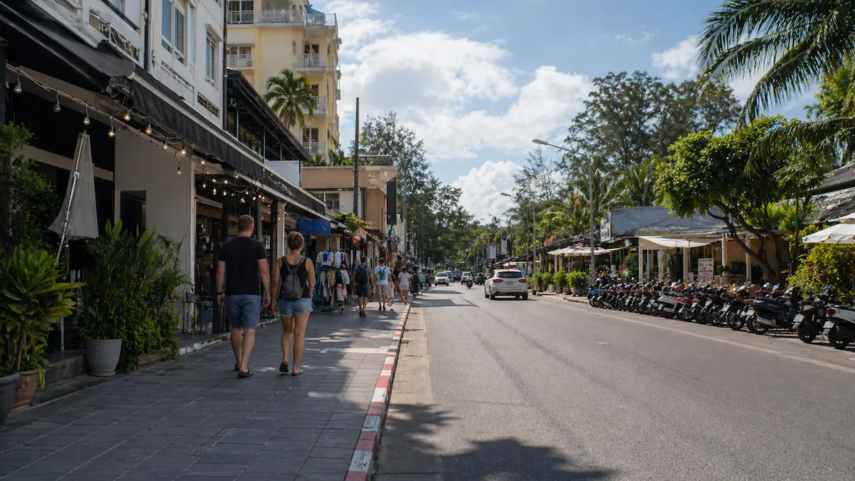 Walkable street near Karon Beach Phuket with restaurants, shops, and tourists