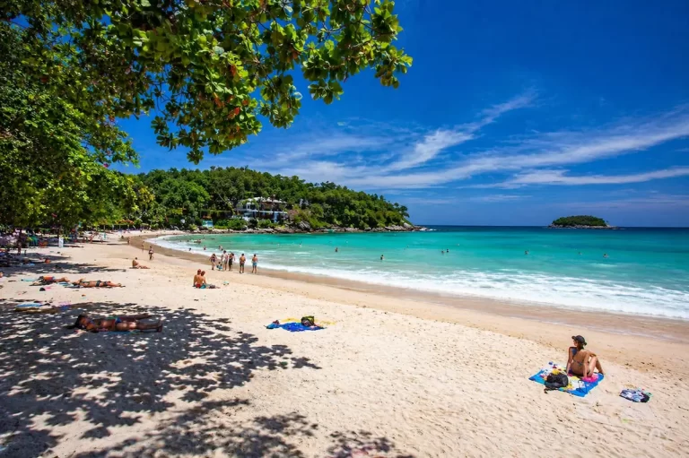 Kata Beach Phuket with white sand, clear water, and visitors enjoying the beach in Thailand