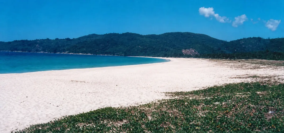 Illustrative example of Patong Beach in the 1970s showing a quiet undeveloped coastline before tourism growth in Phuket