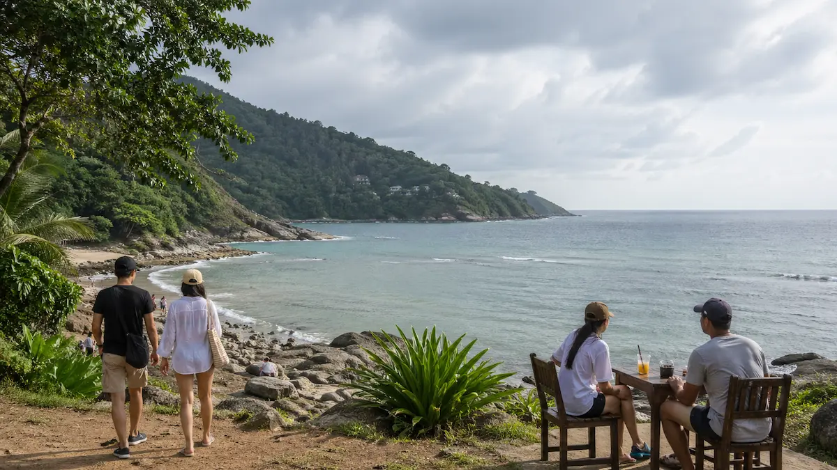 Phuket rainy season coastal viewpoint with travellers enjoying mixed weather during green season