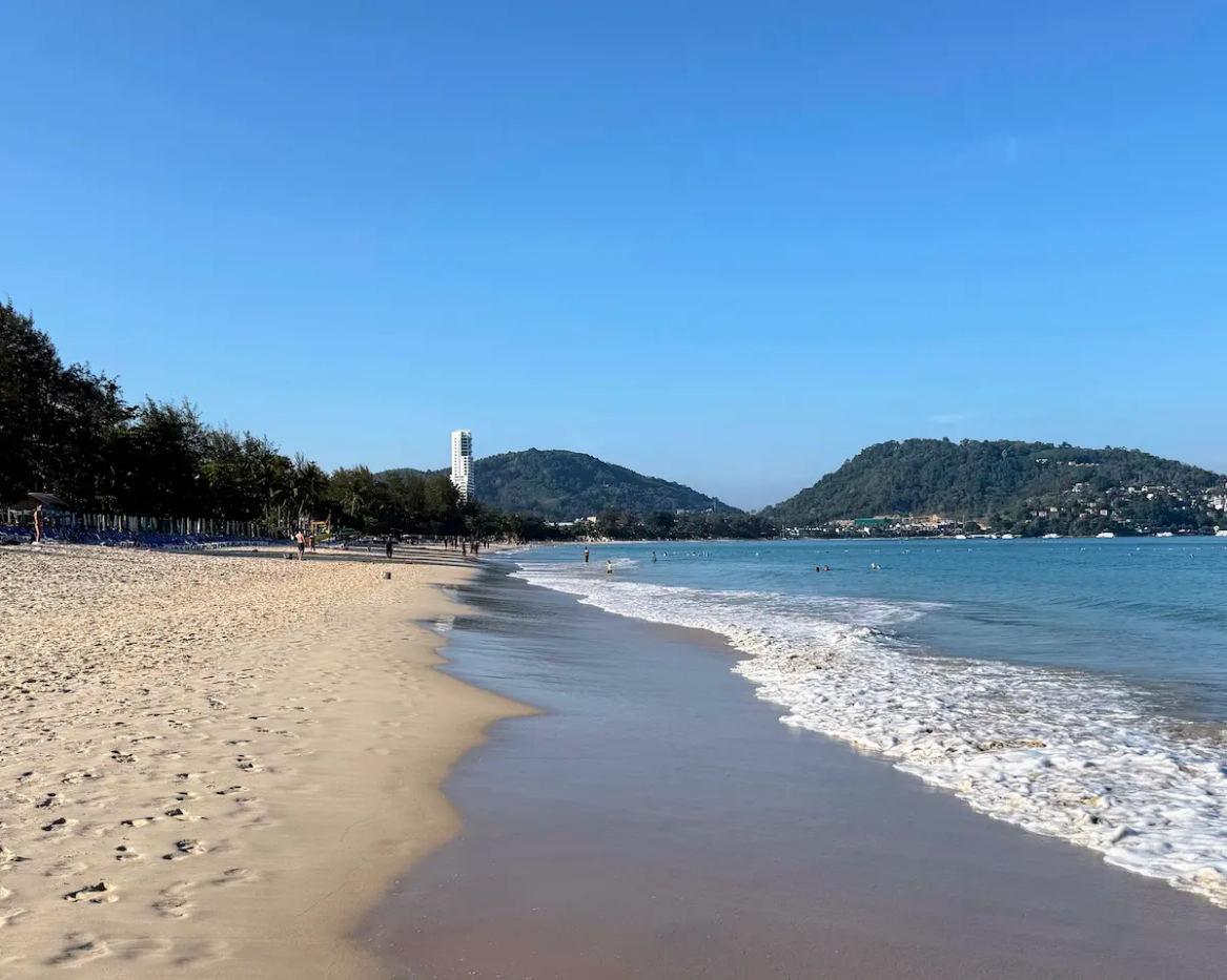 Quieter stretch of Patong Beach with fewer crowds in Phuket Thailand illustrating a more quiet part of where to stay in Patong Beach
