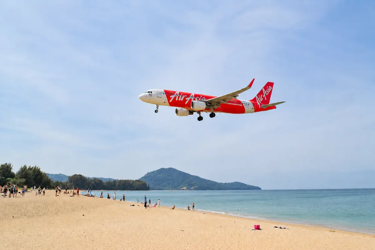 AirAsia plane flying near Nai Yang Beach Phuket