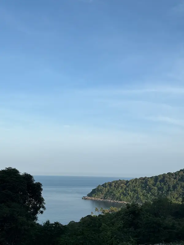 View toward Freedom Beach Phuket through jungle-covered hills