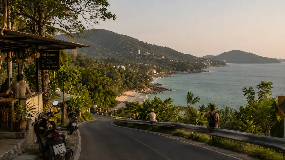 Quiet coastal road and tropical viewpoint overlooking the Phuket coastline in Thailand