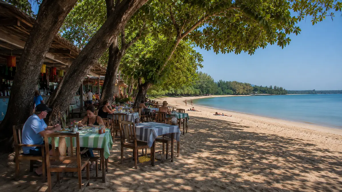 Beachside restaurants under trees at Nai Yang Beach Phuket