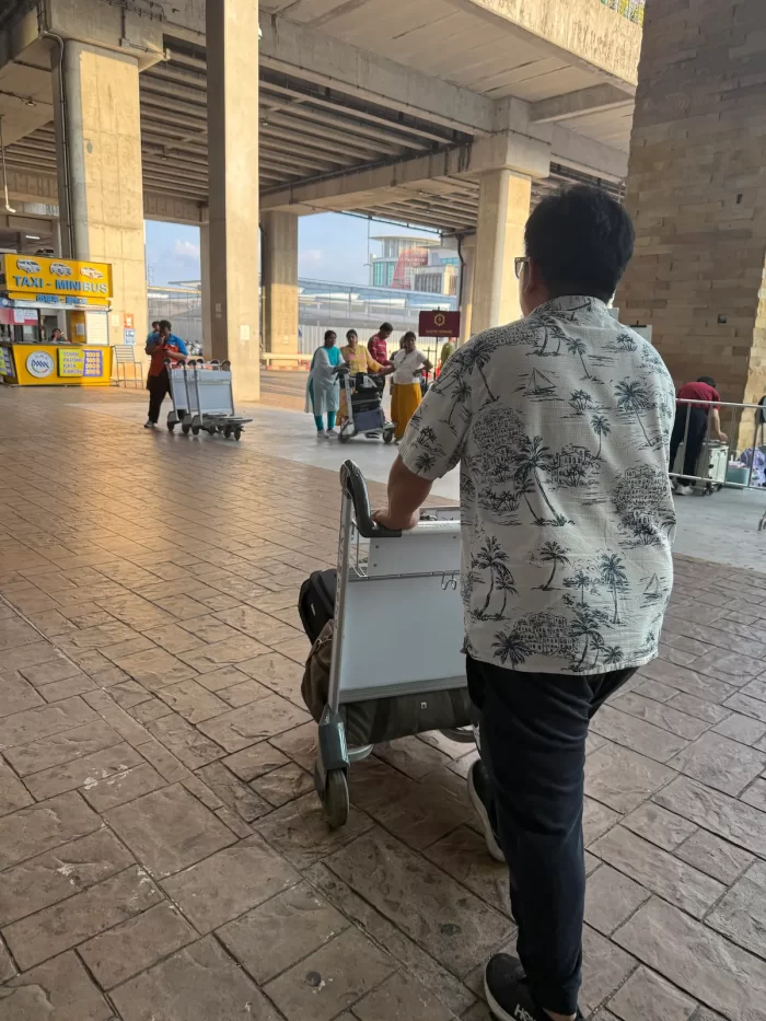 Phuket airport private transfer staff taking luggage outside the terminal for hotel transfer