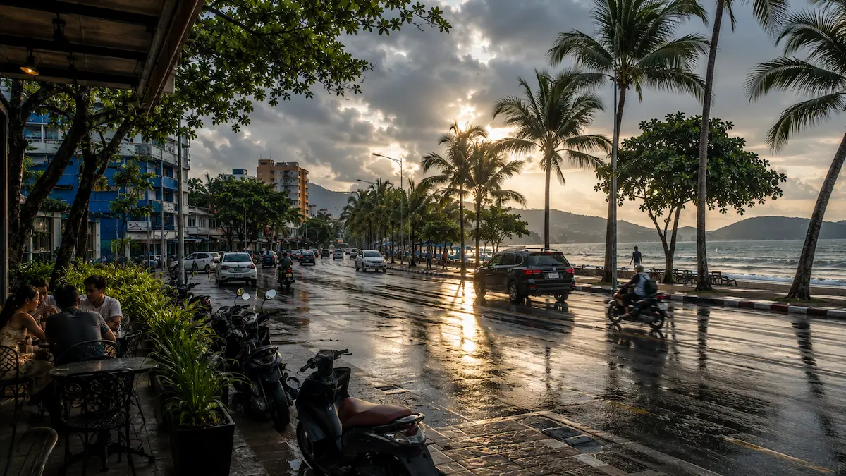 Patong Beach road after tropical rain during Phuket rainy season with clearing skies and wet reflections in 2025
