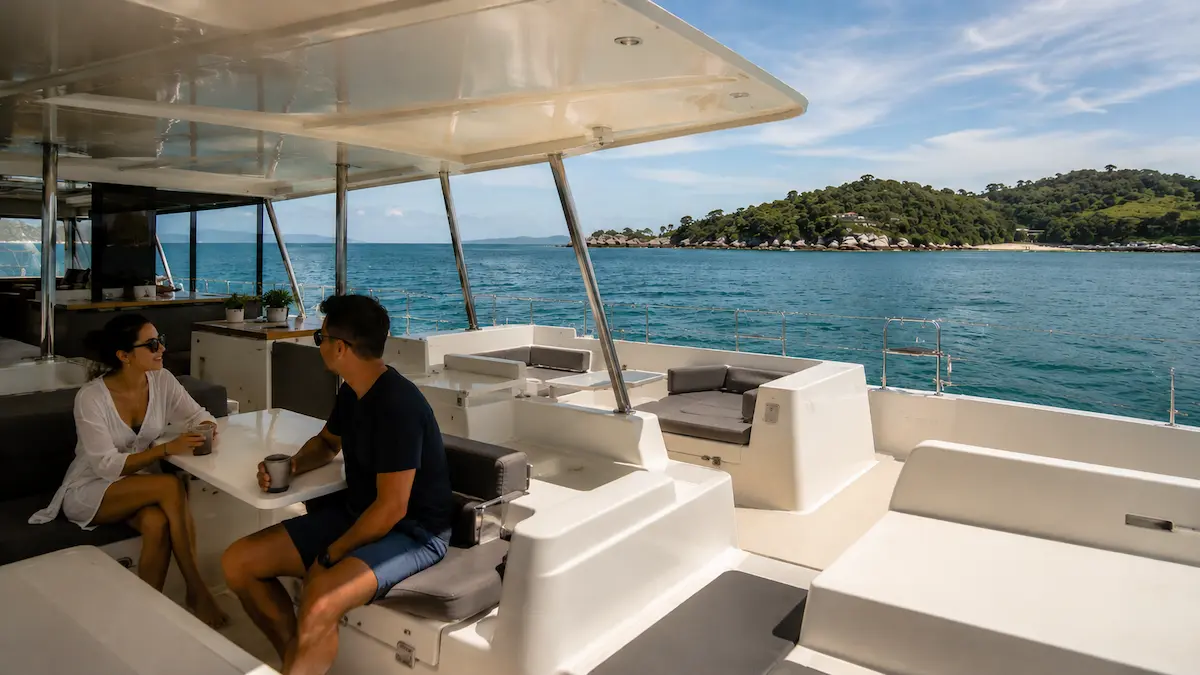 Relaxed island tours Phuket onboard catamaran near Coral and Racha Island with spacious seating and calm cruising atmosphere