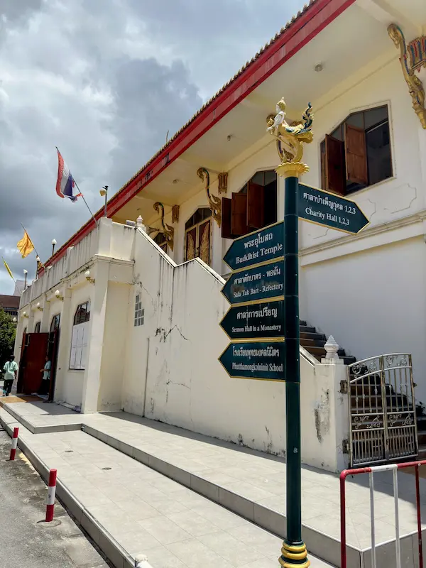 Temple direction sign near a Buddhist temple in Phuket Old Town