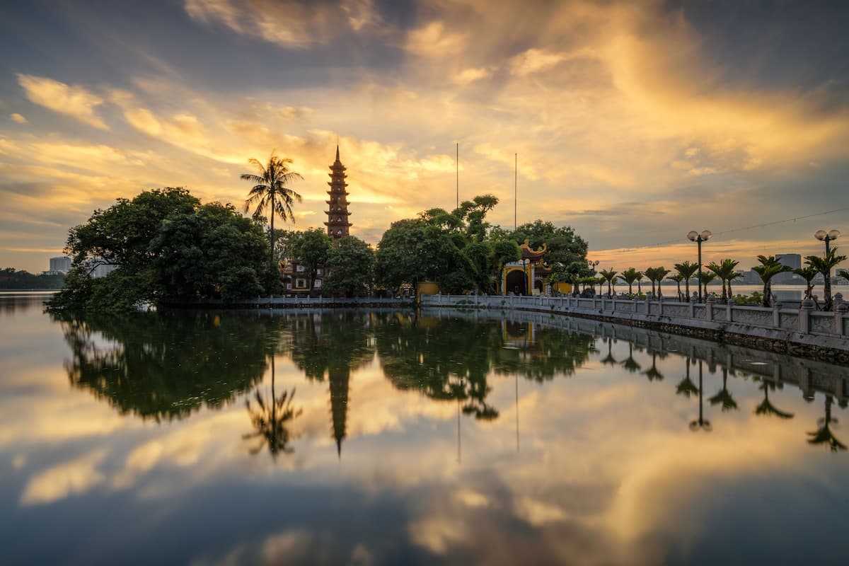 About Go Find Asia – Tran Quoc Pagoda reflected in West Lake at sunset in Hanoi, Vietnam