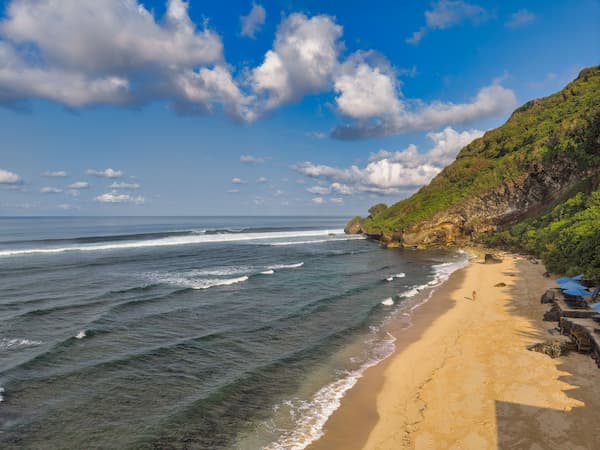 Bali, Indonesia – tropical beach and green coastal headland beside the Indian Ocean
