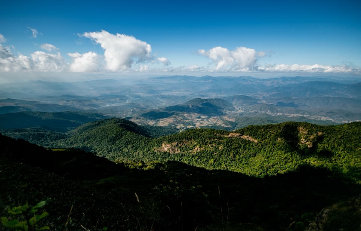 Northern Thailand – mountain ranges stretching into the distance beneath scattered clouds