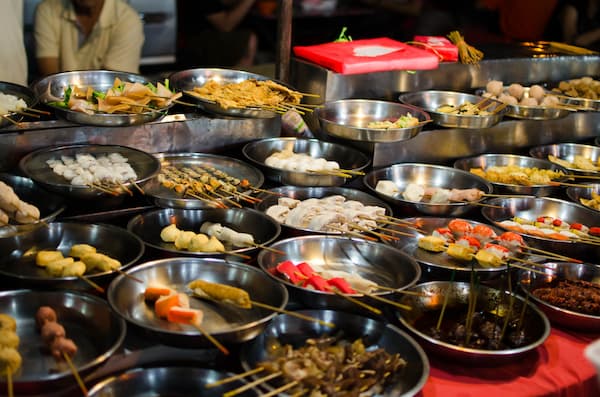 Taste of Asia – colourful selection of skewers and local food at an Asian street market